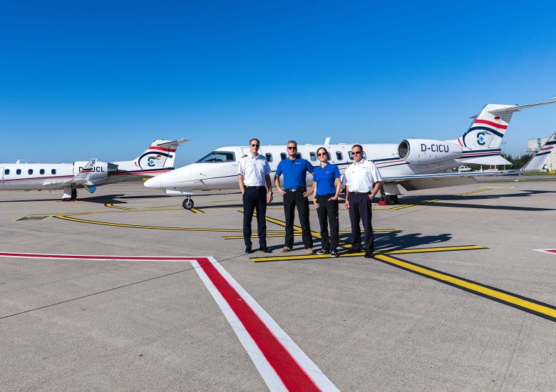 Aeromedical crew in front of an ambulance jet